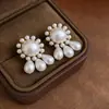 Aguja de Plata Redonda Forma de Gota de Agua Moda Minimalista Colgante Pendientes de Perla Luz de Lujo Pendientes de Gama Alta Elegantes y con Estilo para Mujeres
