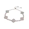 Pulsera de cordón con flor de circonita y nácar estilo francés, que irradia una vibra fresca y elegante, un accesorio de nicho y sofisticado, versátil para cualquier atuendo, diseñado para mujeres