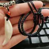 Venta caliente diente real perro negro imitación diente de lobo colgante mastín del Tíbet diente año de nacimiento femenino colgante regalo hombres étnico mujeres pareja