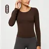 Top de yoga sin costuras ajustado de tejido cepillado para otoño e invierno, transfronterizo, para mujer, cuello redondo clásico, alta elasticidad, transpirable, manga larga, top deportivo para fitness