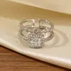 Anel de Girassol Cravejado com Diamantes de Novo Produto Transfronteiriço, Toque de Luxo Leve e de Alto Padrão, Anel Duplo Geométrico Aberto Ajustável de Zircônia
