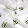 Fábrica en stock hilo modelador blanco bordado primavera y verano verde oscuro pequeña flor ropa de escenario ropa infantil tela bordada