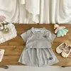 Conjunto de Dos Piezas para Niña de Verano 2026, Nuevo y Elegante, con Cuello Polo, Lindo Top de Manga Corta y Shorts/Falda, de Moda