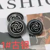 Botão de metal para atacado de Outono e Inverno botão de flor tridimensional botão de moda retrô estilo Chanel botão de fivela de lã para terno jaqueta