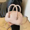 Versión coreana de popular bolsa de almohada portátil de nicho popular 2024 nueva moda casual para mujer bolso de hombro cruzado