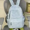 Mochila refrescante de color azul claro texturizada con estampado de estrellas, adecuada para estudiantes para la escuela y clases de fin de semana, bolsa escolar versátil