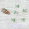 Joyería de moño para uñas al por mayor en línea popular de dos colores Ámbar K oro moño decoración de uñas accesorios de resina