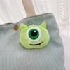 Lindo broche de monstruo de lana azul de dibujos animados verde de ojos grandes, accesorios colgantes para mochila escolar, muñeco de peluche morado de boca grande