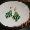 Pendientes de mariposa y flor de circón verde ultrabrillante transfronterizos, sensación de lujo ligero de alta gama, pendientes versátiles con un diseño único