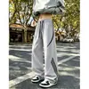 Pantalones casuales de corte holgado estilo americano para hombre, con bloques de color, un diseño otoñal moderno, rayas de pierna ancha, tallas grandes, estilo pantalón paracaídas y un corte recto para un look de alta costura.