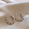 Pendientes geométricos de perlas y circonitas transfronterizos europeos y americanos, pendientes exquisitos de nicho de lujo ligero de alta gama, accesorios para orejas simples y elegantes para mujer