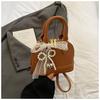 Bolsa Satchel de Nicho com Laço para Mulheres 2025 Nova Moda Primavera e Verão Bolsa Concha com Textura Bolsa Transversal Versátil