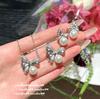Collar de Princesa Escape con Lazo, Piedras Preciosas y Perlas, Anillo de Mar Profundo Farah con Cuentas, Set de Anillos de Zirconia Mariposa