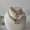Conjunto de Dos Piezas para Pulsera y Collar con Colgante de Mariposa Inteligente con Hebilla de Nutria, Estilo Fragante Ins de Lujo Ligero Transfronterizo, Perla Imitación Barroca