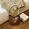 Bolso Cubo Retro de Gama Alta de Nicho para Mujer 2026 Nuevo de Moda Coreana Versátil Bolso de Hombro Bolso de Axila para Mujer