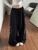 Calça preta de perna larga com strass estilo hip-hop americano para mulheres, calça casual solta com personalidade para dança de rua, calça de moletom para homens e mulheres, moda esportiva de alta rua
