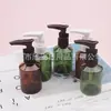 Frasco marrom de 50ml com bomba de clipe, frasco de ombro inclinado, frasco de bomba de loção de 50ml, frasco de refil para gel de banho, frasco de limpador facial