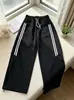 Pantalones de algodón con cordones a rayas deportivas estilo americano para mujer, modelo otoño 2026, de cintura alta, holgados, adelgazantes, versátiles de pierna ancha