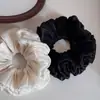 Goma para el pelo plisada con forma de capullo de flor, de lujo ligero y elegante, diadema simple versátil de alta gama, nuevo accesorio para el cabello para mujer