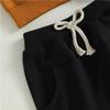 Pantalones de dos colores blanco y negro para bebé transfronterizos con estampado de letras naranjas, manga larga, conjunto de dos piezas YT2316ab