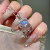 Venta al por mayor del fabricante Xiaohongshu Colgante Natural de Piedra Lunar Cierre Ruyi Plata S925 Incrustada Nuevo Diseño Chino para Mujeres