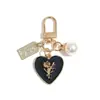 Llavero Lindo Chica Corazón Rosa Amor Placa Aleación Cabeza de Llavero para Coche Colgante de Auriculares Accesorios para Colgar en Bolsos