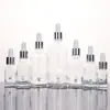 Botella vacía de subenvasado de aceite esencial cosmético transparente al por mayor botella de subenvasado de líquido de vidrio botella gotero con cabeza de plástico de 5-100 ml