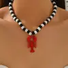 Estilo Vacacional de Ocio Marino de Verano Transfronterizo Serie Vida Marina Langosta Pintura Roja Aleación Vieira Pendientes para Mujer
