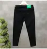 Cyber Popular Jeans Negros Puros para Hombre Marca de Moda Slim-fit Pantalones Recortados de Pie Pequeño Pantalones Casuales Blancos para Hombre Tipo Espiritual