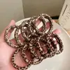 Anel de Toalha com Estampa de Leopardo Transfronteiriço da Amazon Anel de Cabelo Corda de Cabelo de Tendão de Couro Ponda de Alta Elasticidade para Mulheres Acessórios de Cabelo Europeus e Americanos Adorno de Cabeça