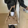 Bolso de axila de nicho para mujer 2026 Nuevo Otoño/Invierno Estilo coreano Moda Hueco Bolso de un solo hombro Versátil Bolso de mano para ir al trabajo