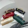 Nuevo bolso de noche de lujo ligero transfronterizo para mujer, bolso de mano cilíndrico de color liso con asa de serpiente para fiestas de cóctel y banquetes