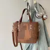 Bolso de mano de alta calidad de comercio exterior para mujer, nuevo bolso de mano de color liso vintage para el verano de 2026, bolso tipo cubo versátil, simple y casual