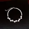 Pulseira redonda geométrica transfronteiriça com zircônia, toque de luxo leve de nicho de alta qualidade, simples e elegante, acessório de mão versátil