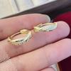 Pendientes ligeros de lujo con microincrustaciones de circonitas, hebilla para oreja, diseño de nicho femenino, pendientes con giro distintivo, elegantes y avanzados.