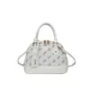 Popular bolsa europea y americana vintage de concha floral, bolso de mano versátil de alta gama, moda transfronteriza 2026, bolso de hombro, bolso cruzado para mujer