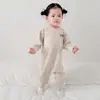 Nuevo mameluco de seda para primavera y otoño para bebés, con diseño de hombros descubiertos, mangas largas, estilo pullover y se puede usar como traje para gatear, pijama o camiseta interior.