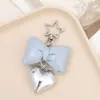 Colgante de teléfono móvil de cuero con lazo relleno de algodón, nuevo nicho coreano, colgante de llavero de bolso de alta gama para mujer