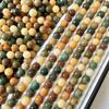 Venta al por mayor de fábrica raíz de bodhi natural color tinta espesa pulsera de cuentas redondas cuentas sueltas cuentas para joyería DIY plato de cuentas pulsera para jugar mujeres