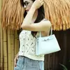 El popular bolso con cierre de este año presenta un diseño de nicho, ofreciendo una sensación de lujo ligero y alta gama.. Es un bolso de hombro versátil de gran capacidad para el día a día para mujer.