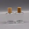 Botella de perfume premium de 50ML tapa de madera botella de perfume de bayoneta botella de perfume portátil tapa de nogal botella de vidrio