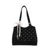 Bolso de axila grande de estilo coreano transfronterizo para mujer, nuevo modelo primavera 2026, bolso de hombro estampado simple, bolso tote para el trabajo