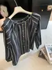 Camisa feminina listrada de manga longa estilo vintage francês, novo modelo outono 2026, corte solto, estilosa e elegante para o trabalho