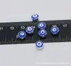 Al por mayor ojo de diablo de cuentas doradas y plateadas 6*8mm cuenta de ojo plana gota de aceite de doble cara agujero recto accesorios de joyería DIY dispersos