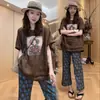 Conjunto de moda para mujer 2026 verano nuevo estilo, top holgado de manga corta de moda con pantalones de pierna ancha estampados, conjunto de dos piezas casual