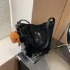Bolso de hombro cruzado de moda versátil estilo explosivo transfronterizo para mujer, bolsa de mano de gran capacidad para el trabajo, bolso de mano simple estilo coreano para mujer
