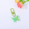 Llavero colgante de mariposa de resina de colores creativos, accesorio DIY para decoración de mochila, venta al por mayor desde el fabricante