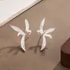 Aretes de clip para oreja de flor de magnolia tridimensional de temperamento iris estilo chino lujo ligero diseño de nicho estilo celebridad de internet artístico