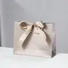 Bolsas de Papel con Moño de Regalo en Stock para Comercio Exterior y Compras Transfronterizas, Personalizables con Impresión de Logo, Envío Gratis