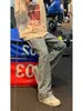 Jeans Azul Claro Estampado Completo Jacquard de Letras para Hombre Primavera Estilo Americano Marca de Moda Ajuste Delgado Pantalones Scimitar